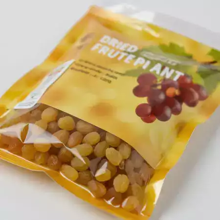 Golden seedless raisins from Thompson grapes dried naturally showing plump texture and rich amber golden color